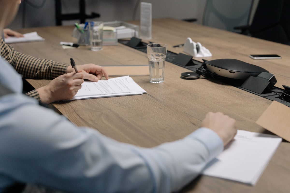 Professionals reviewing documents together in a meeting