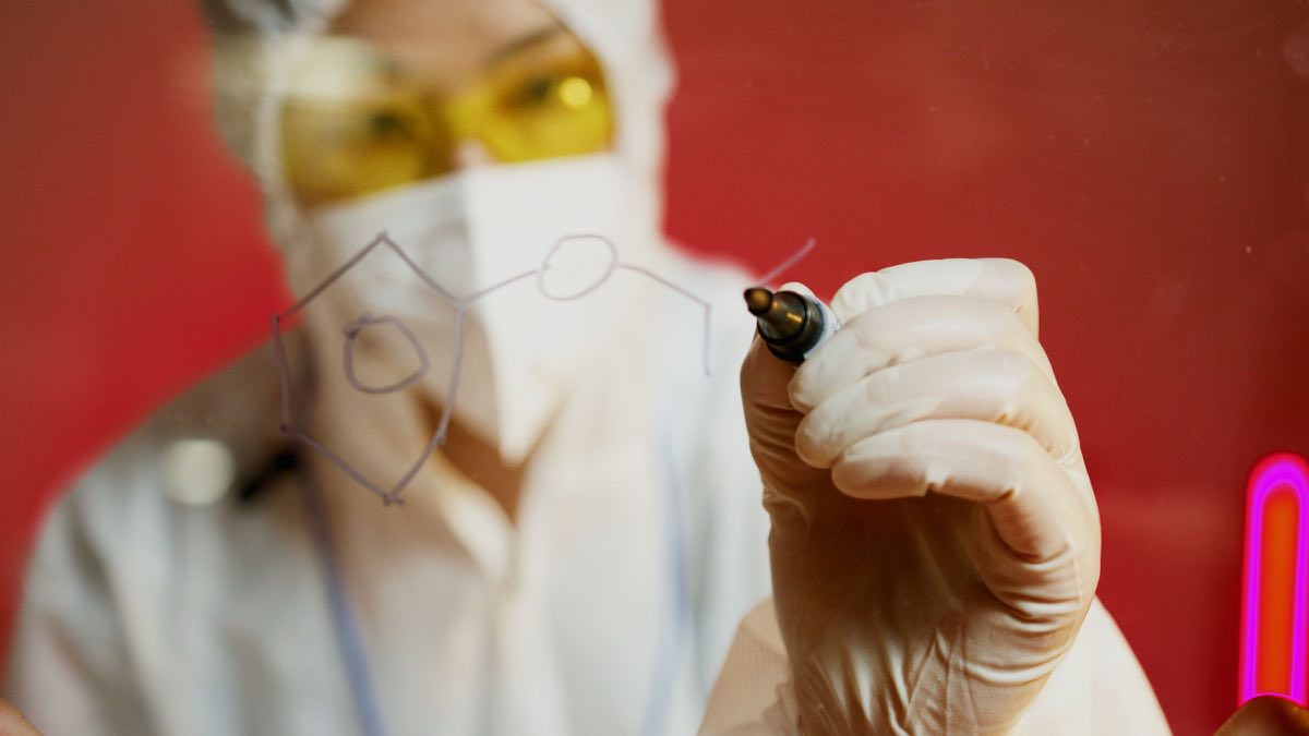 Scientist examining a molecular structure in a laboratory