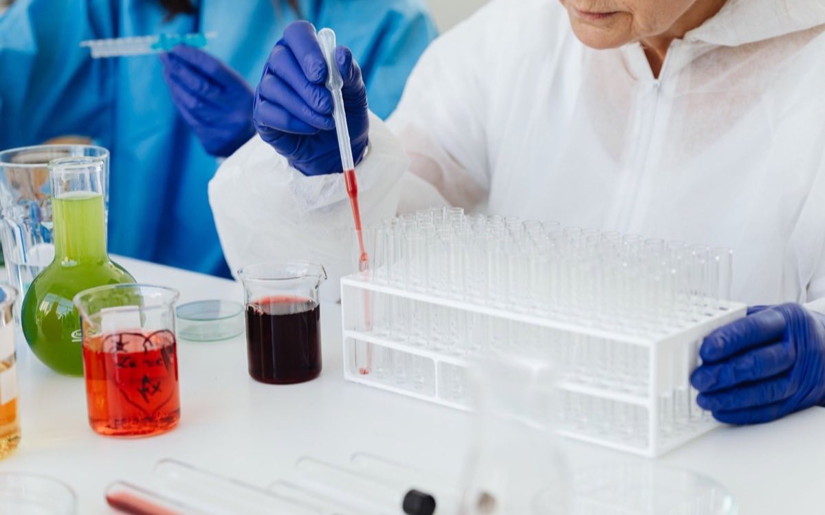 Scientist preparing a biologic sample in a bioprocessing laboratory