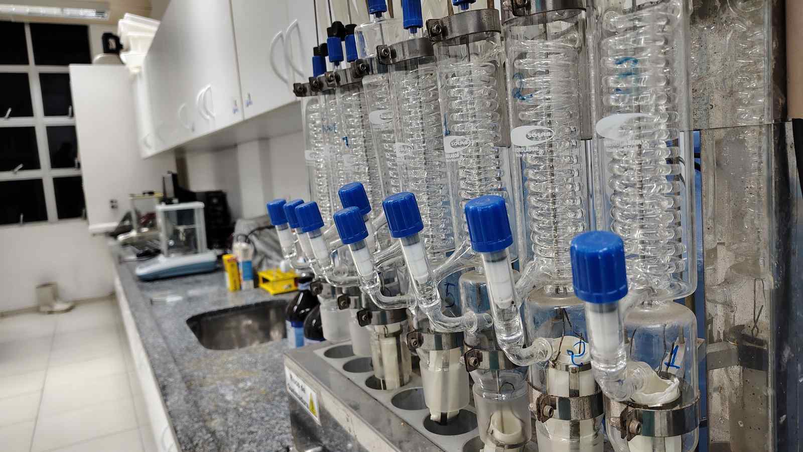A modern laboratory setup with glass condensers and equipment