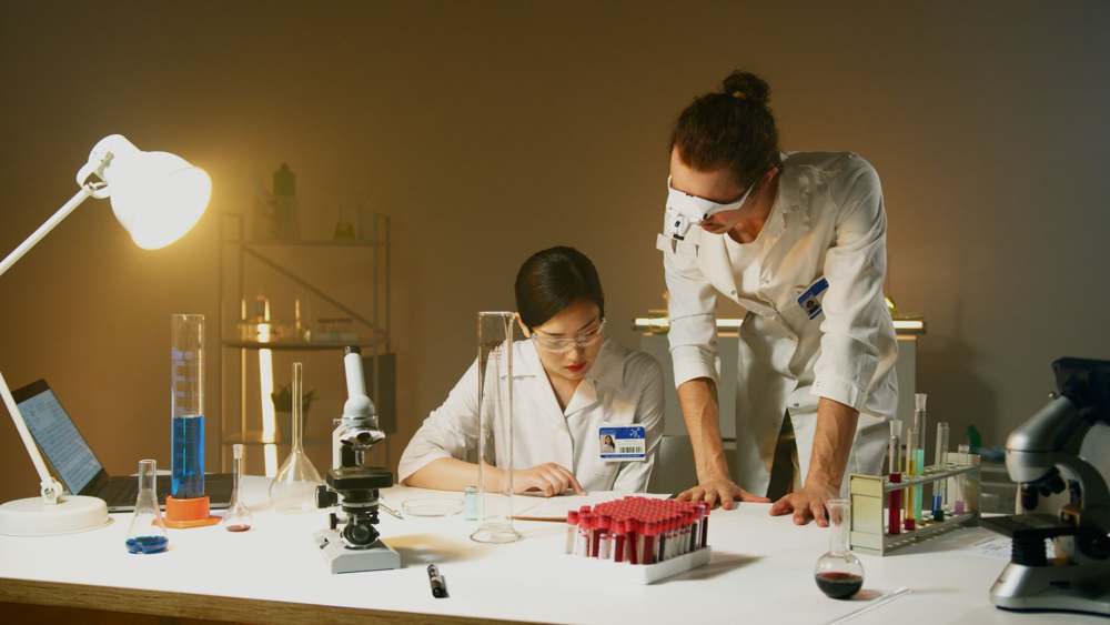 Scientists comparing analytical data in a laboratory