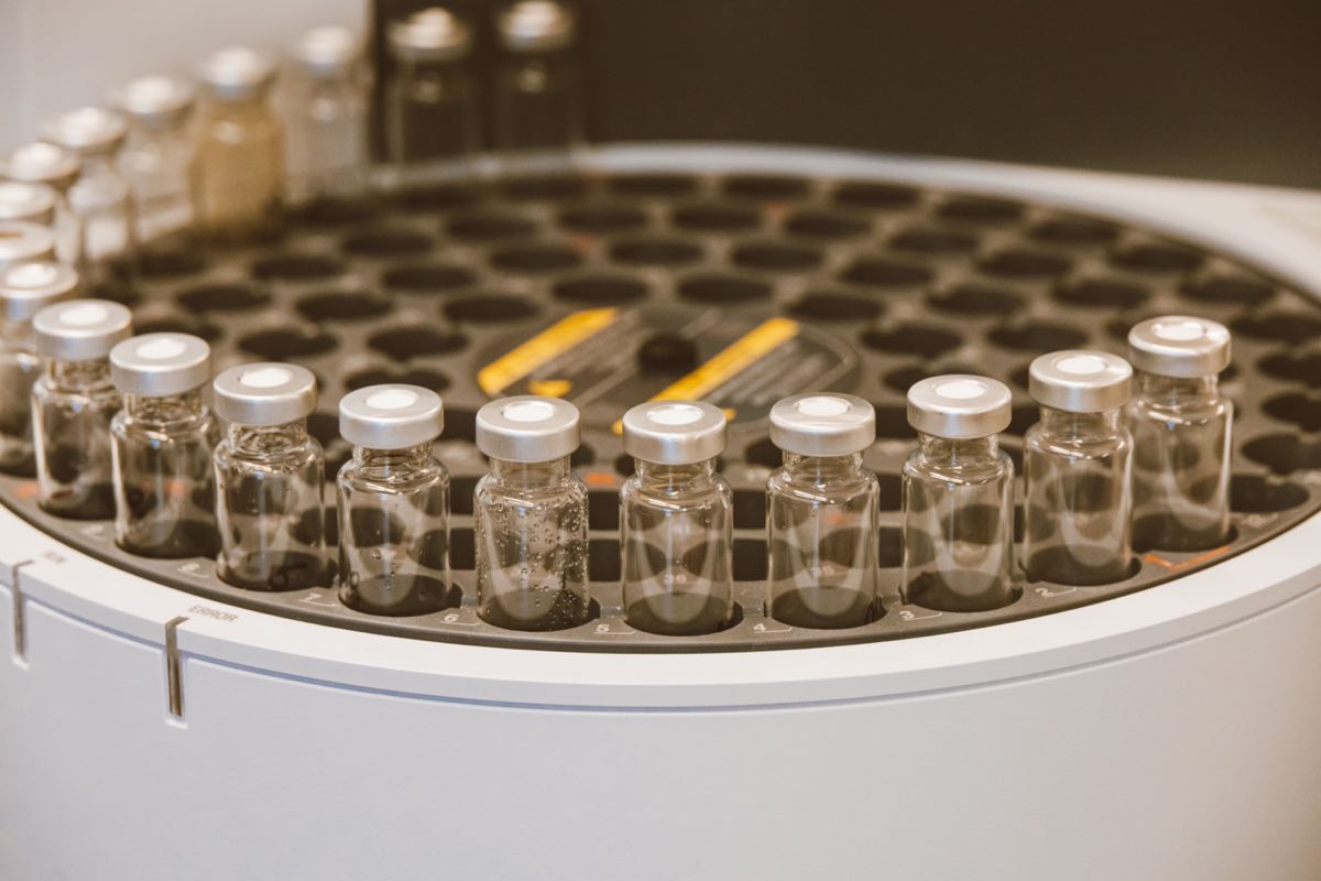 An array of glass vials in a laboratory setting