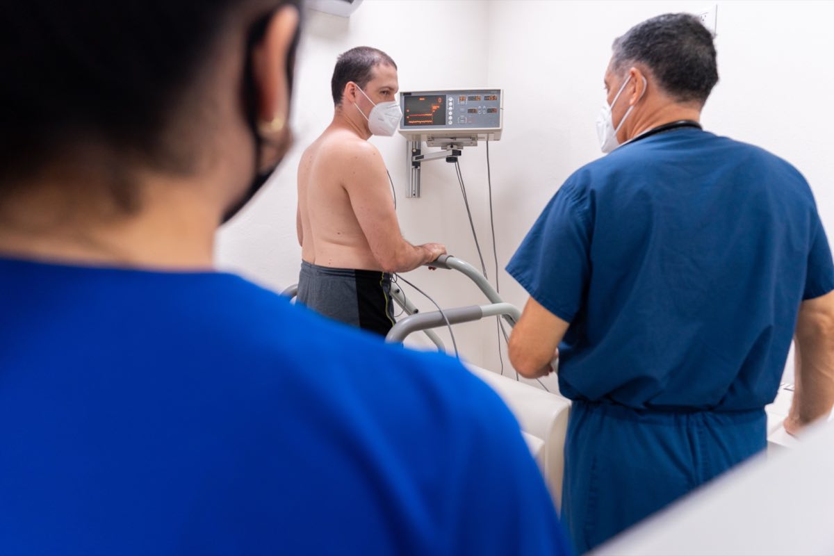 Cardiology stress test with clinicians monitoring a patient