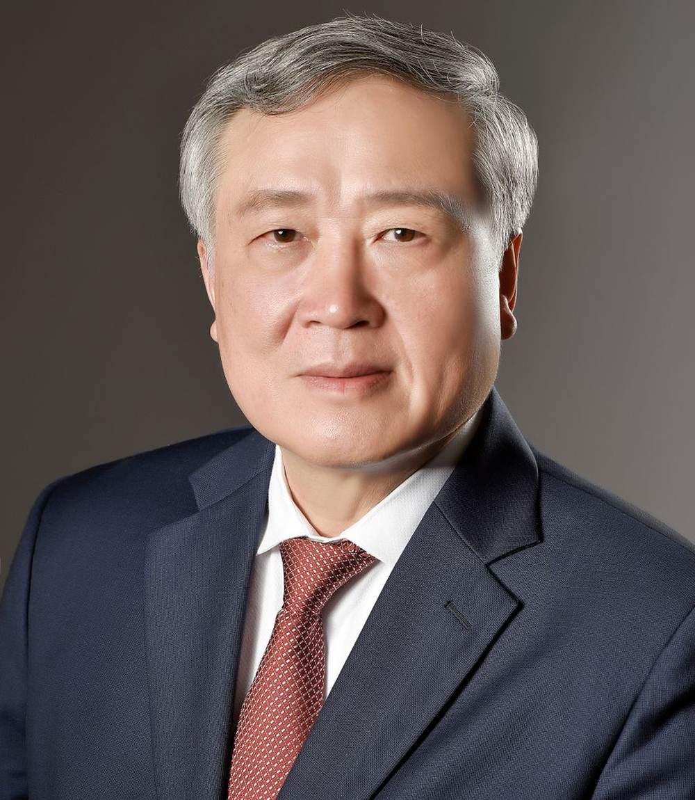 A distinguished senior regulatory executive in a tailored suit
