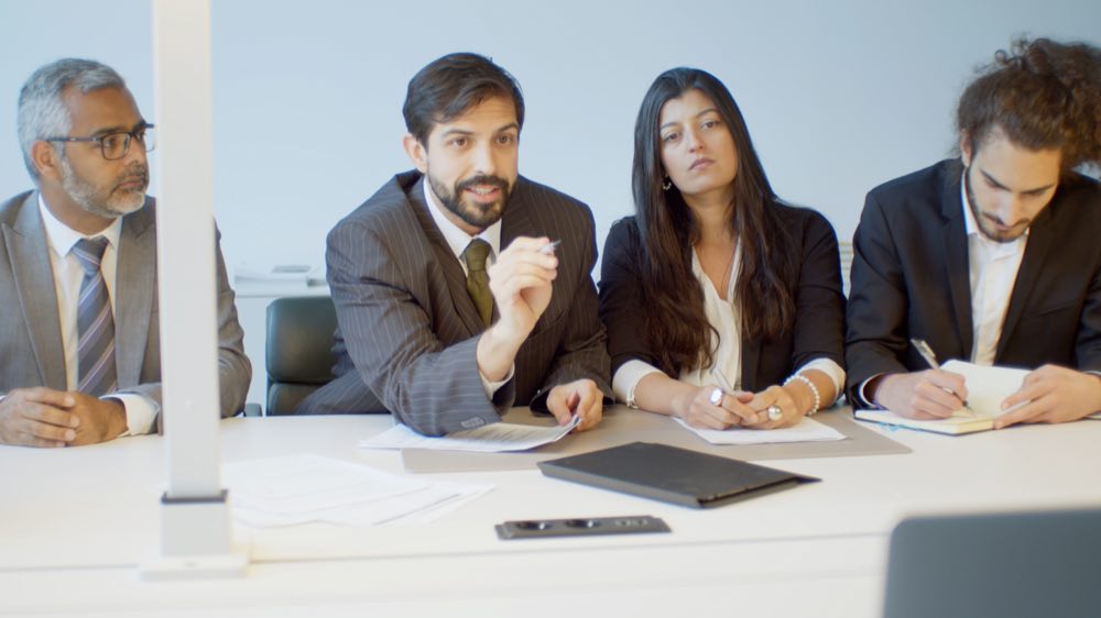 International regulatory consultants in discussion