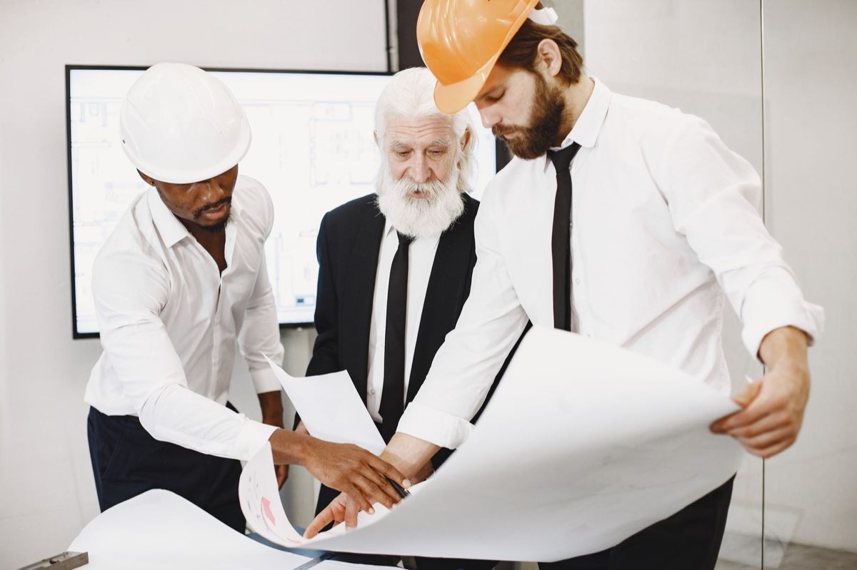 Engineers reviewing change documentation against the plan