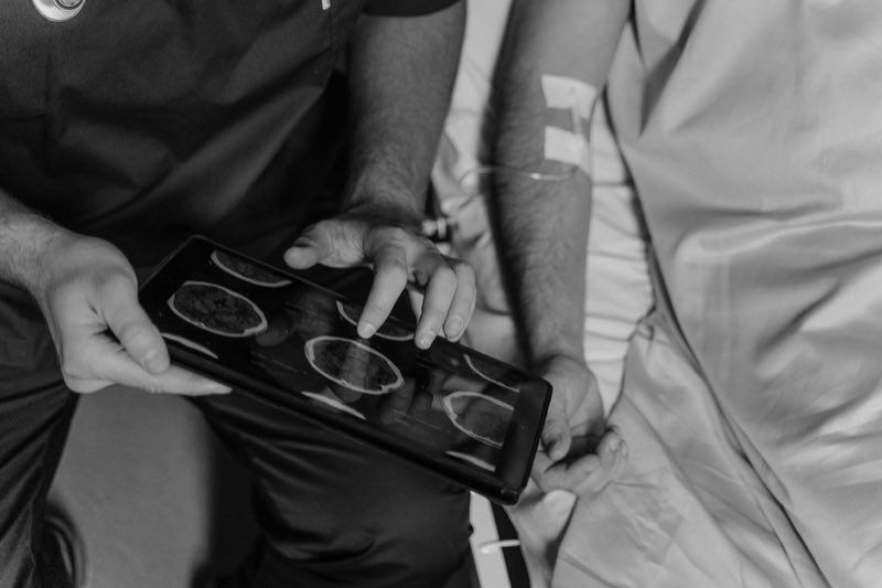 Clinician reviewing diagnostic imaging as clinical evidence for a device evaluation