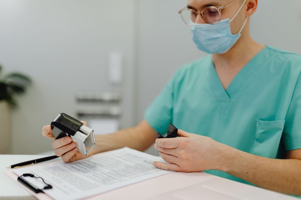 Clinical quality auditor reviewing trial documentation