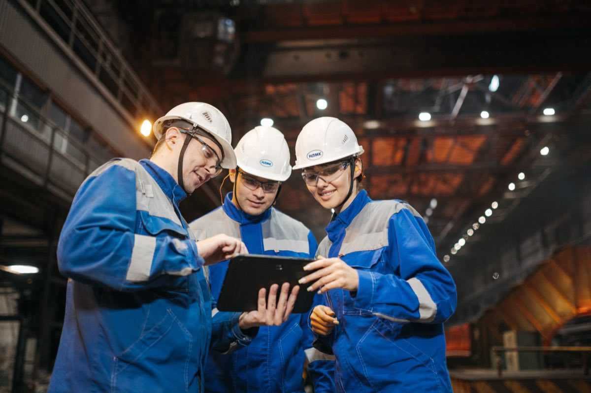 Engineers commissioning process equipment on a build