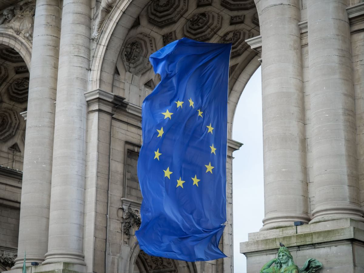 The European Union flag outside an institutional building in Brussels