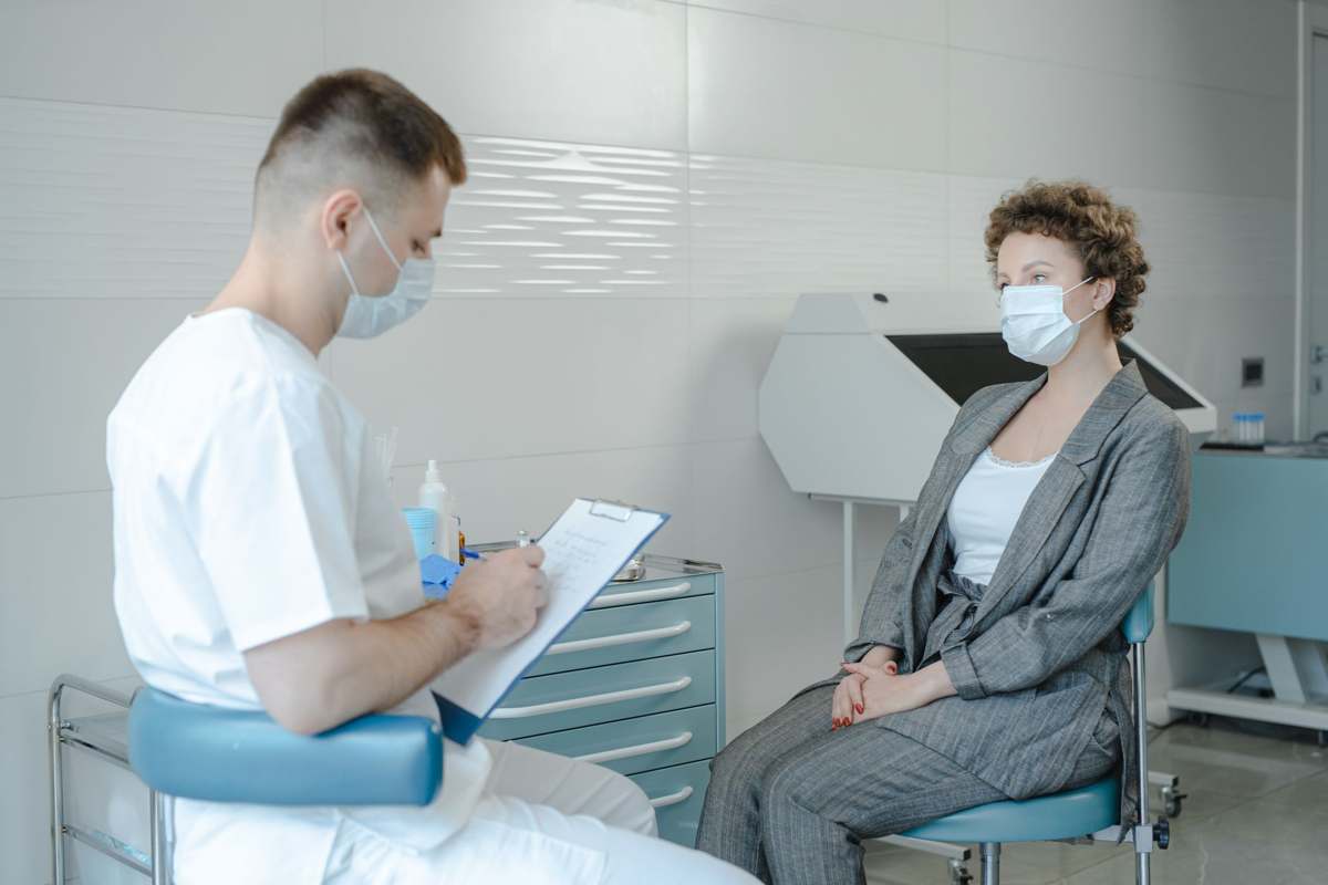 A doctor consulting with a patient in a clinical setting