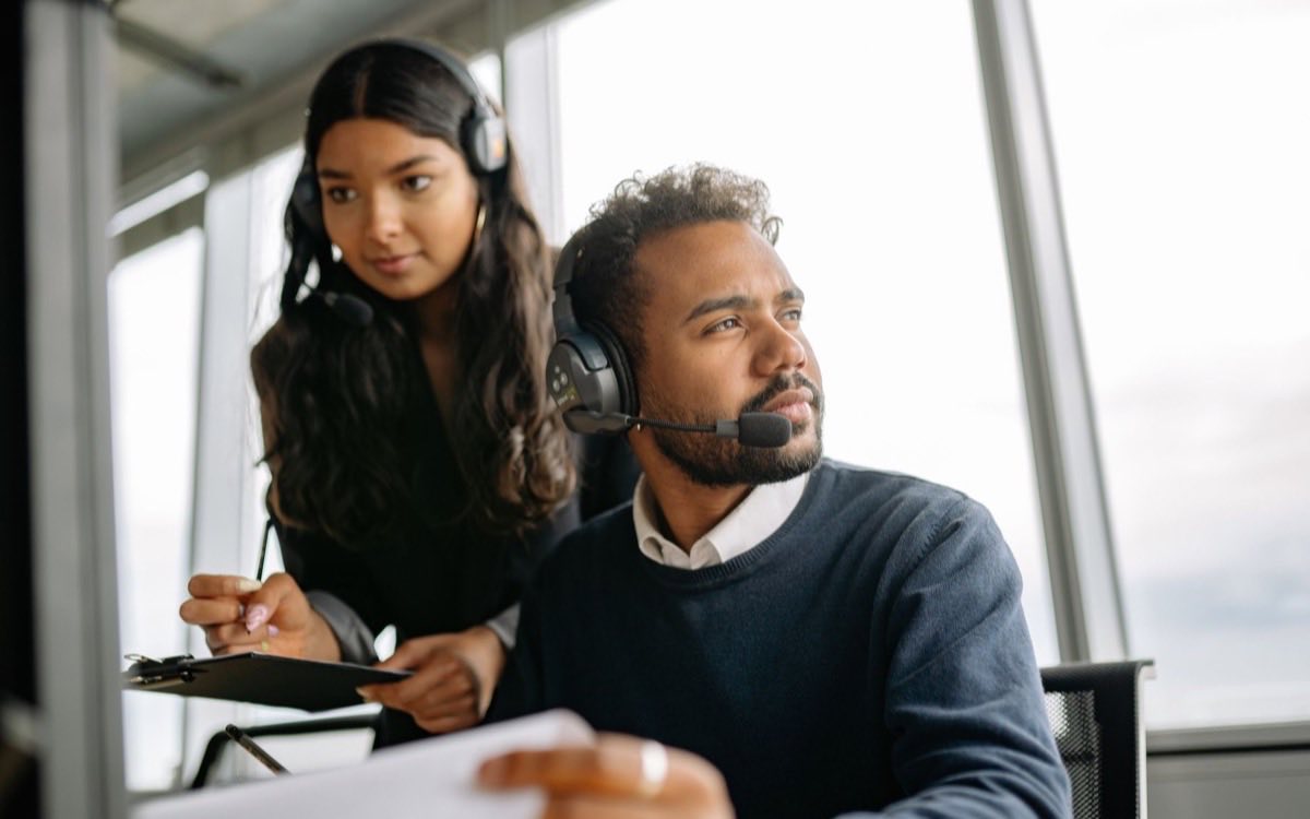 Quality specialist logging a device complaint at a workstation
