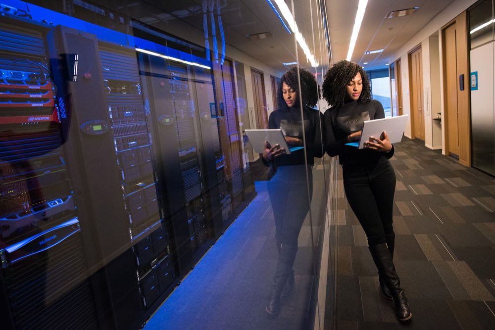 Validation specialist working among data-center servers