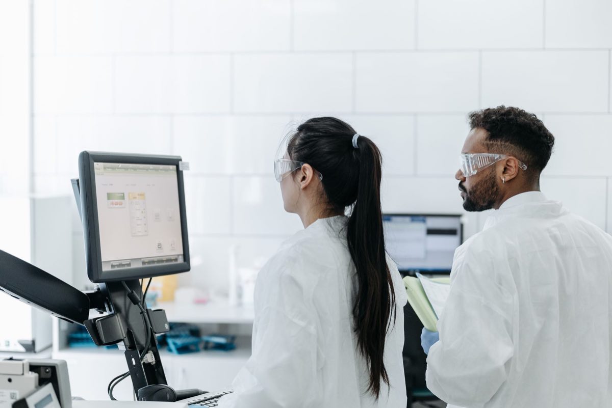 Scientists reviewing results on a laboratory computer