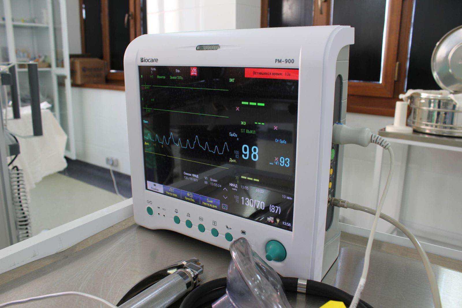 A clinical monitor displaying ECG data at a patient bedside