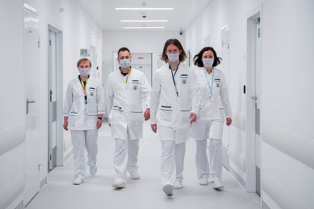 A medical team walking together in a hospital corridor