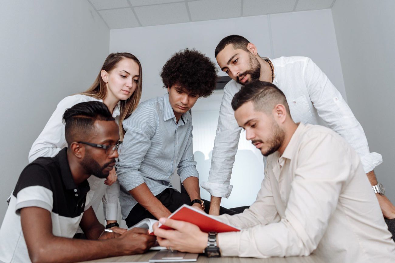 A regulatory and quality team collaborating around a table