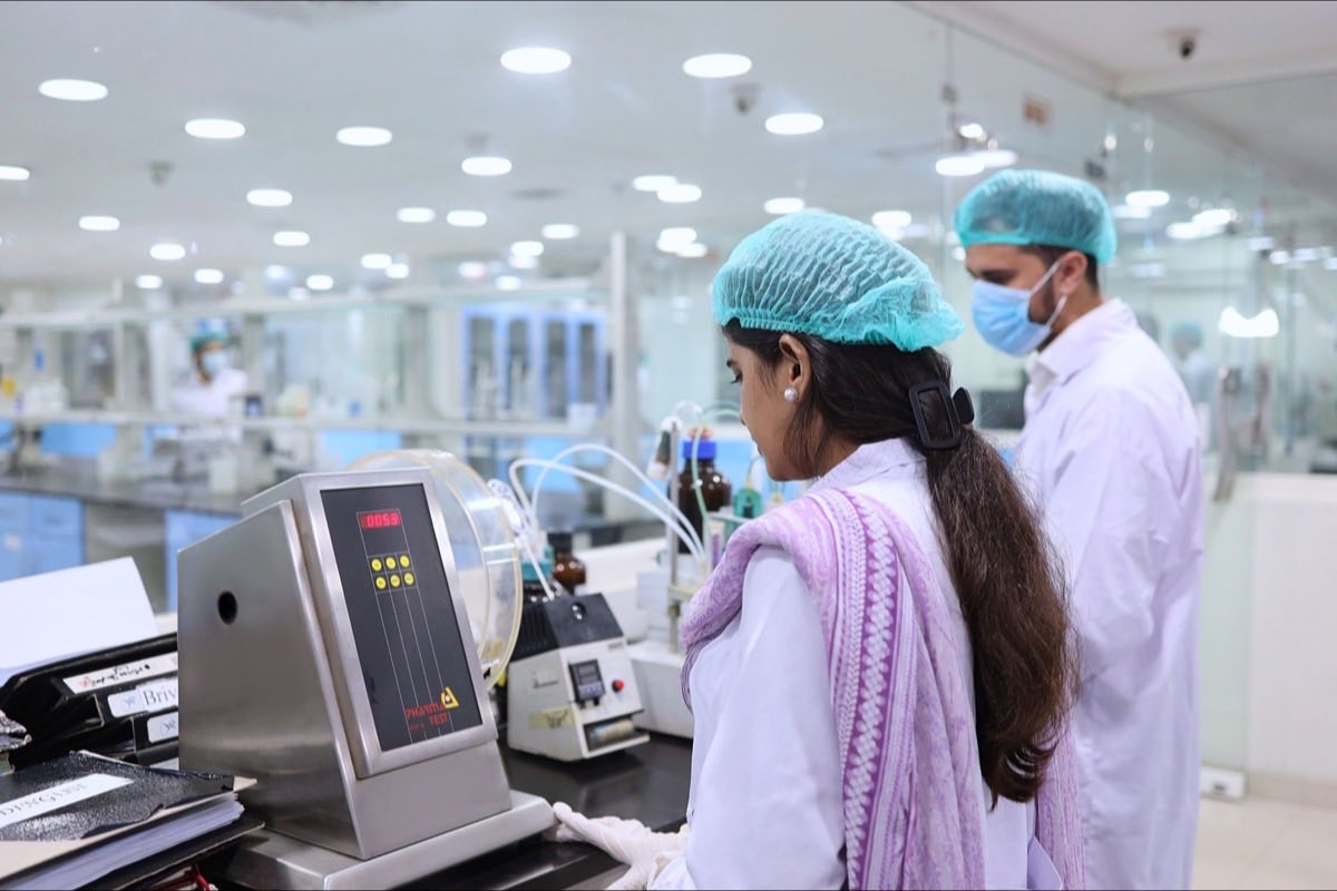 Technician conducting verification testing on a medical device in a lab