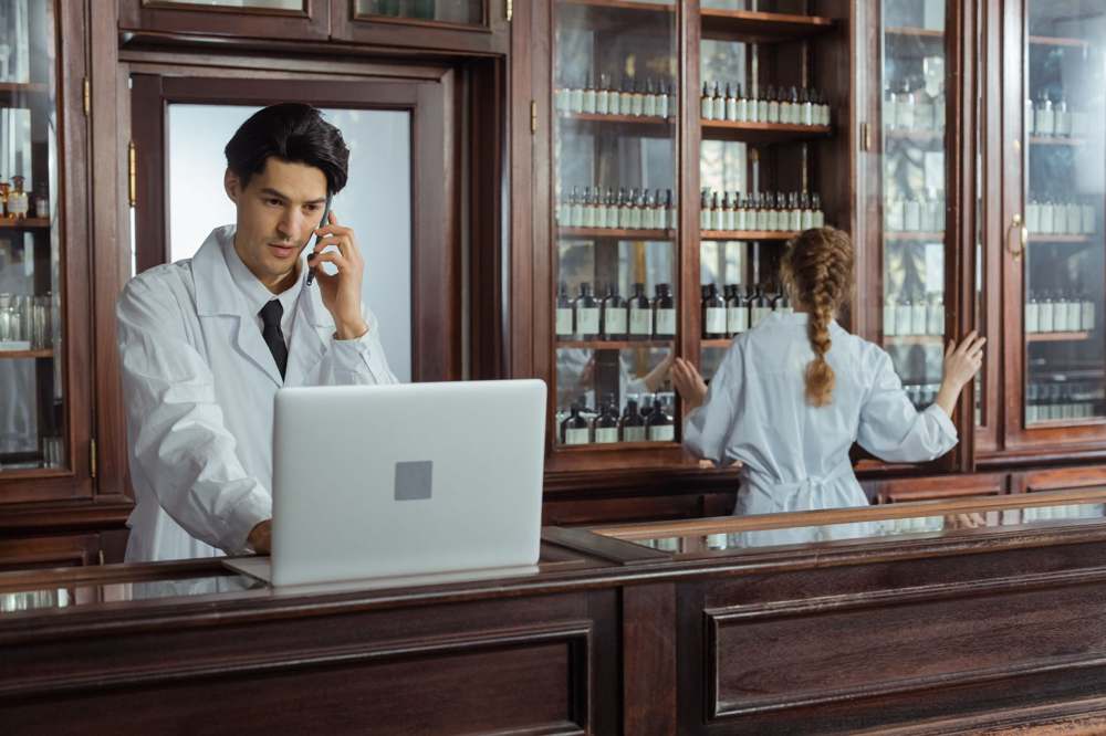 Pharmacists organizing medicines in a pharmacy