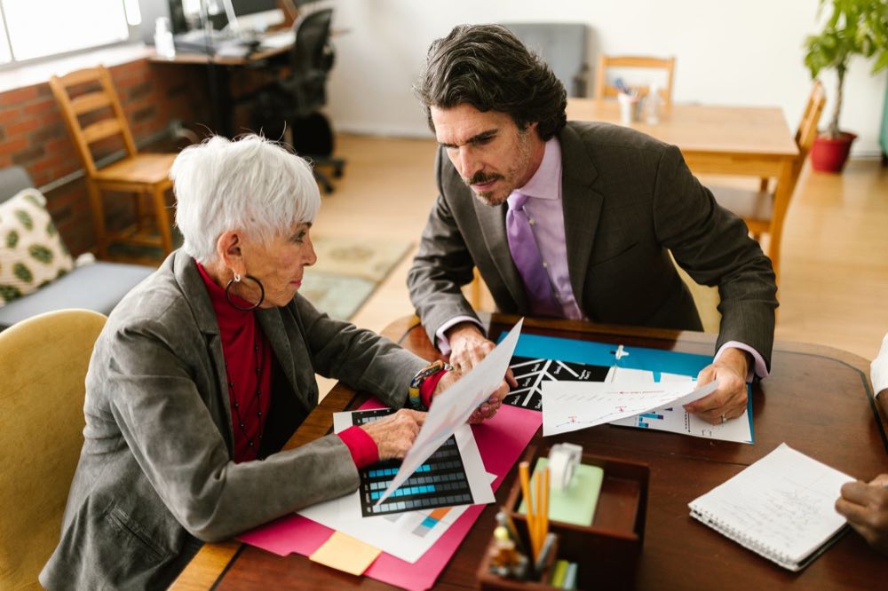 Senior reviewers examining regulatory and quality records during a diligence engagement