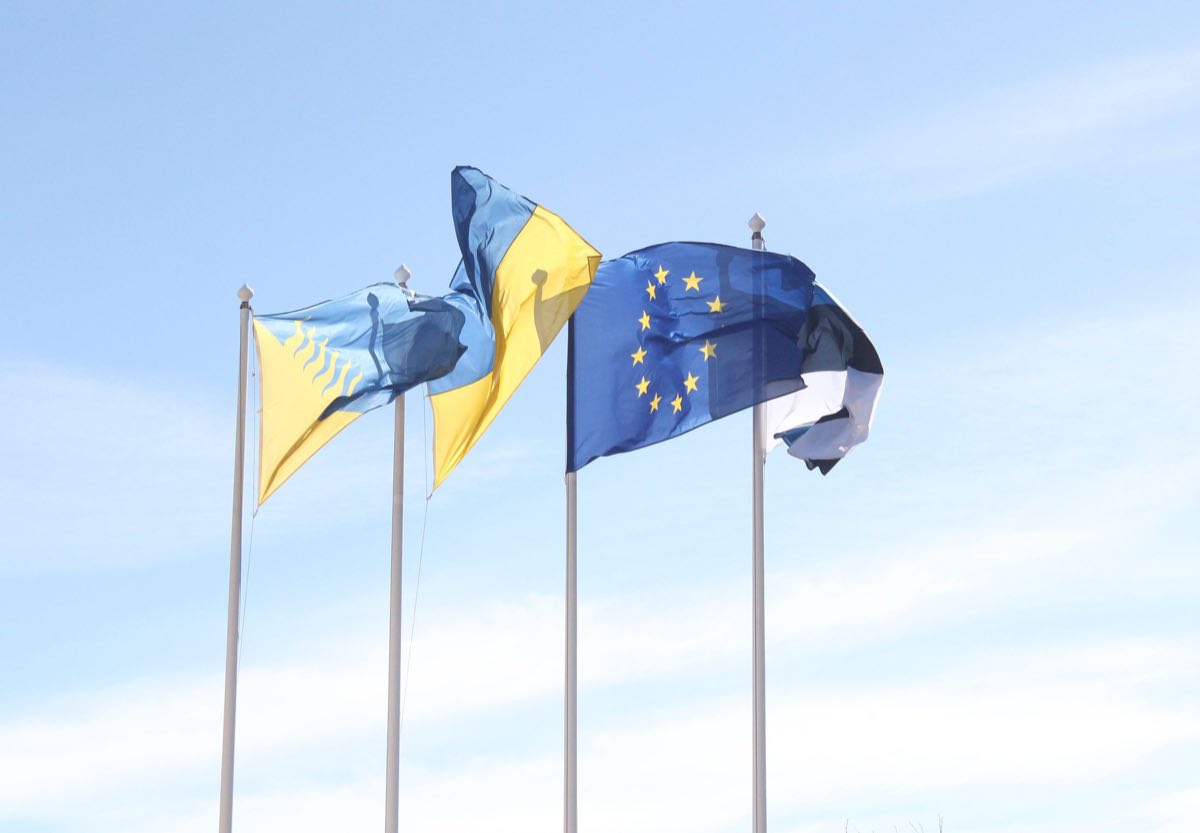 European Union flags flying against a clear sky