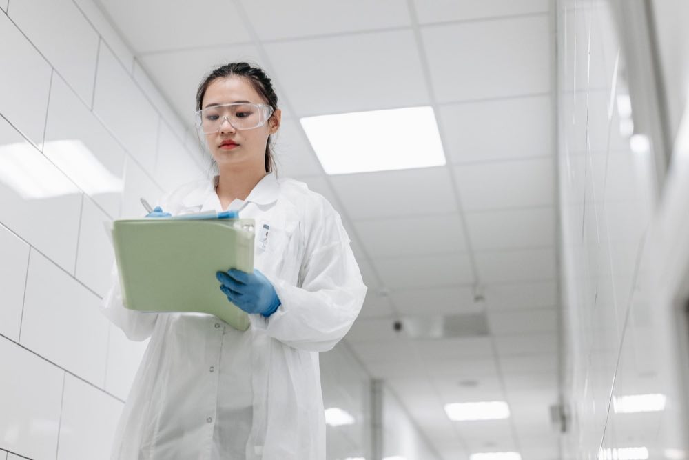 GxP compliance specialist documenting a facility walkthrough