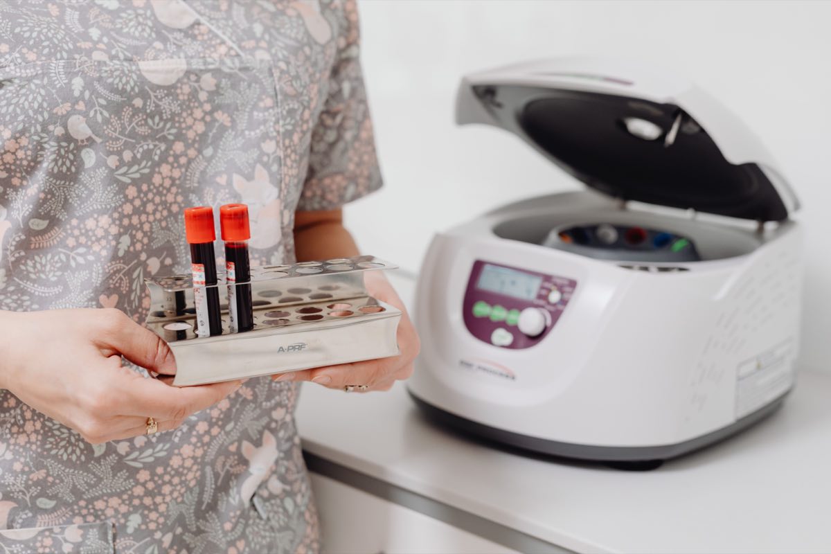 Hematology regulatory scientist reviewing blood samples