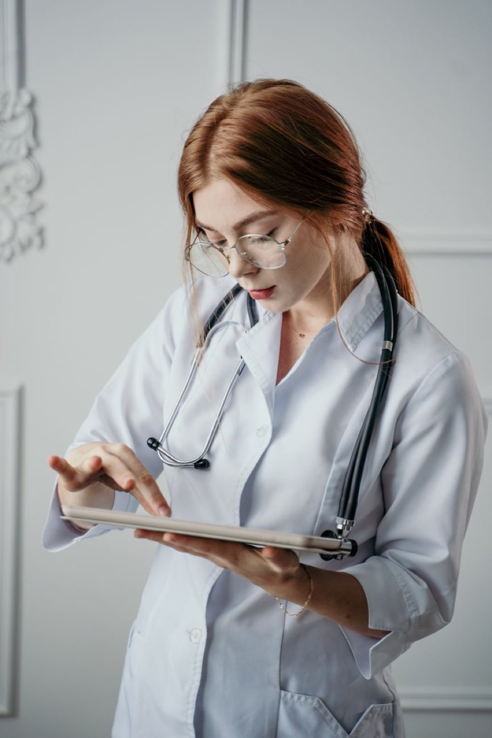 Physician reviewing patient data on a tablet