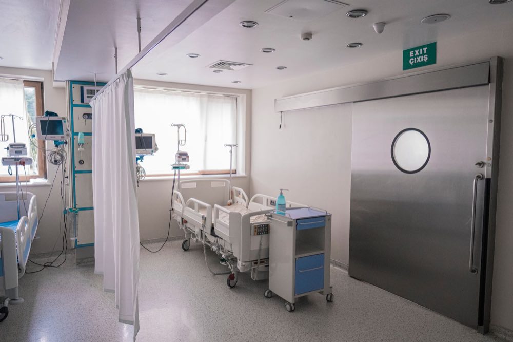 Spacious hospital room in Baku featuring medical beds and equipment