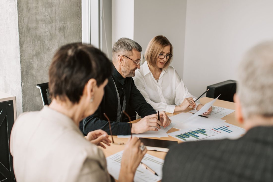 A fractional regulatory leader working alongside a client's team over strategy documents
