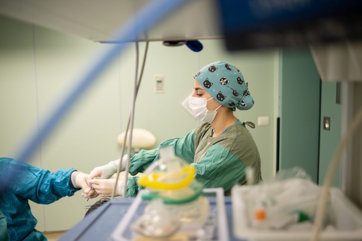 A clinician operating a medical device in a care setting