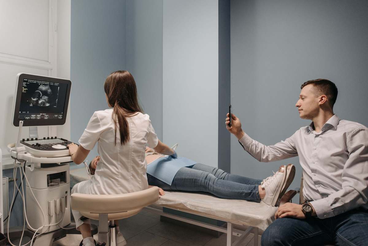 A clinician performing an ultrasound examination