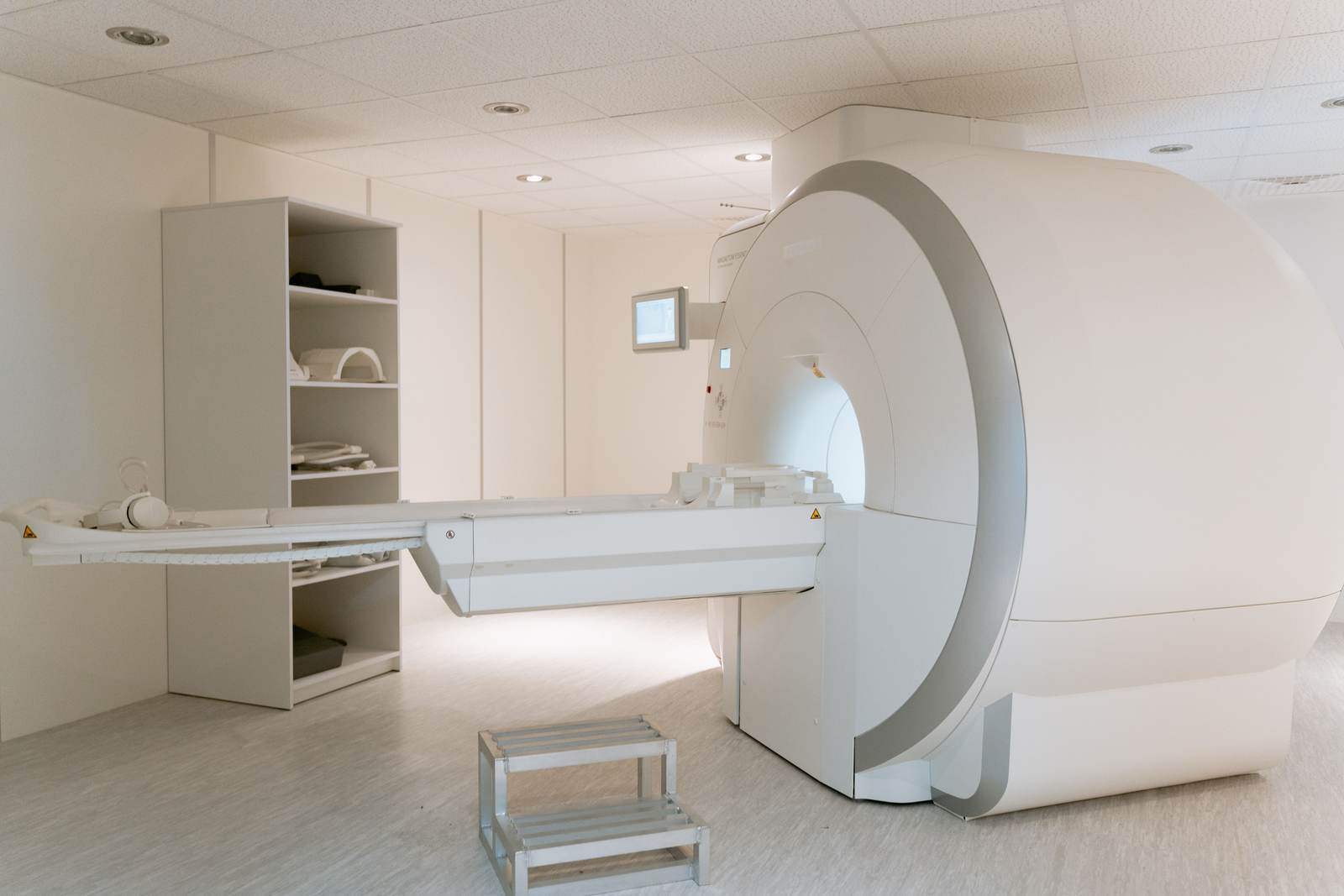 The interior of a modern MRI scanner room in a hospital