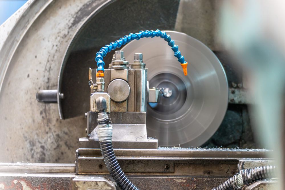 Precision lathe machining a metal component