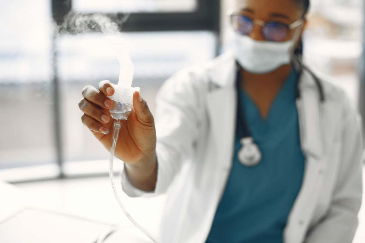 A clinician preparing a nebulizer treatment