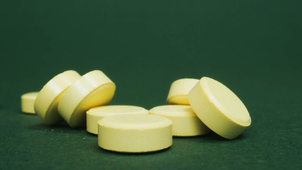 Close-up of scattered tablets representing a dose