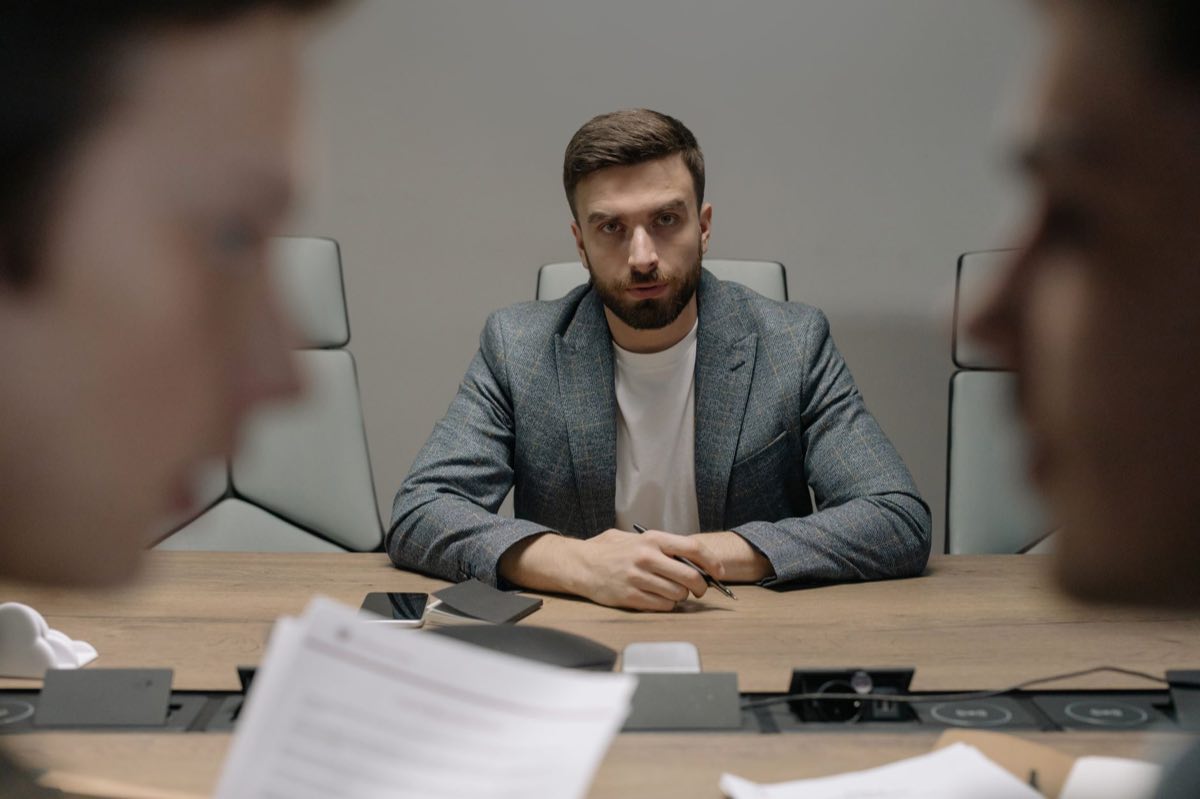Executives in a serious discussion around a conference table