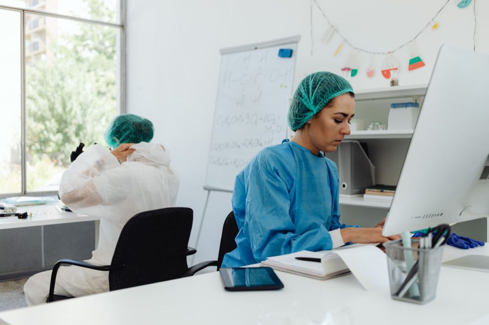 Two scientists reviewing laboratory results together