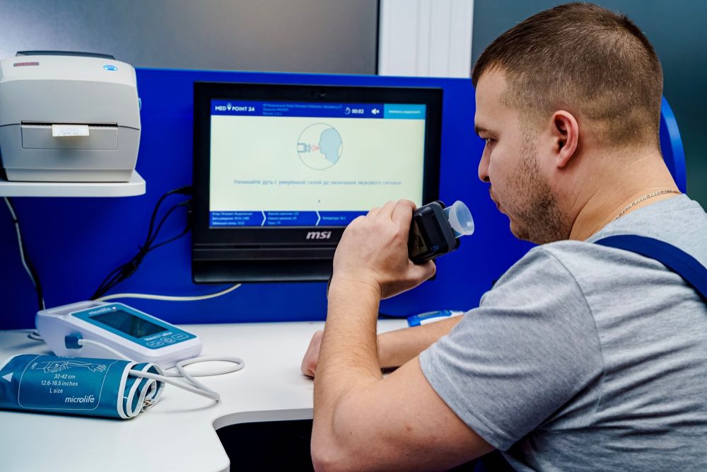 Quality engineer working with a medical device on the bench