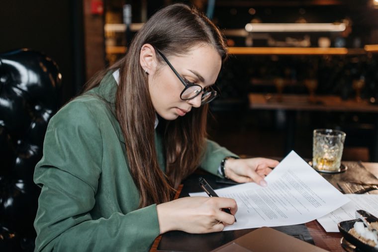 Executive preparing sell-side data room documents ahead of buyer due diligence