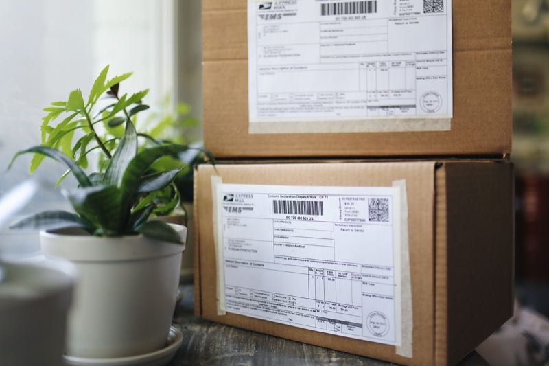 A close-up of shipping and import documentation