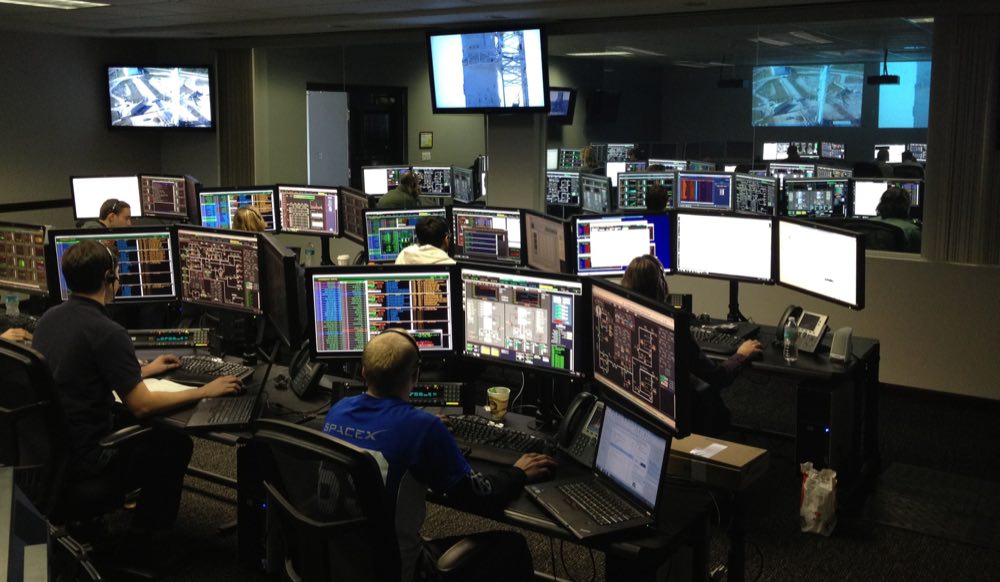 An operations professional working at a computer in an office