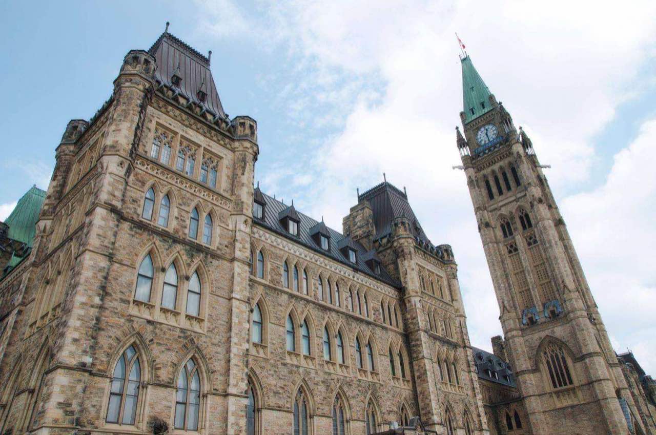 The Parliament of Canada buildings in Ottawa against a blue sky