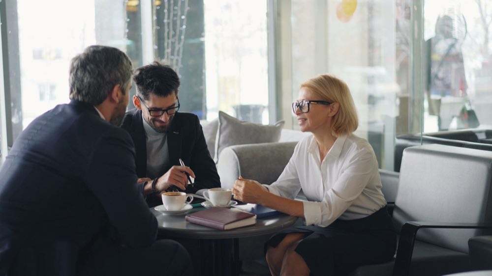 Regulatory consultants reviewing a strategy document together