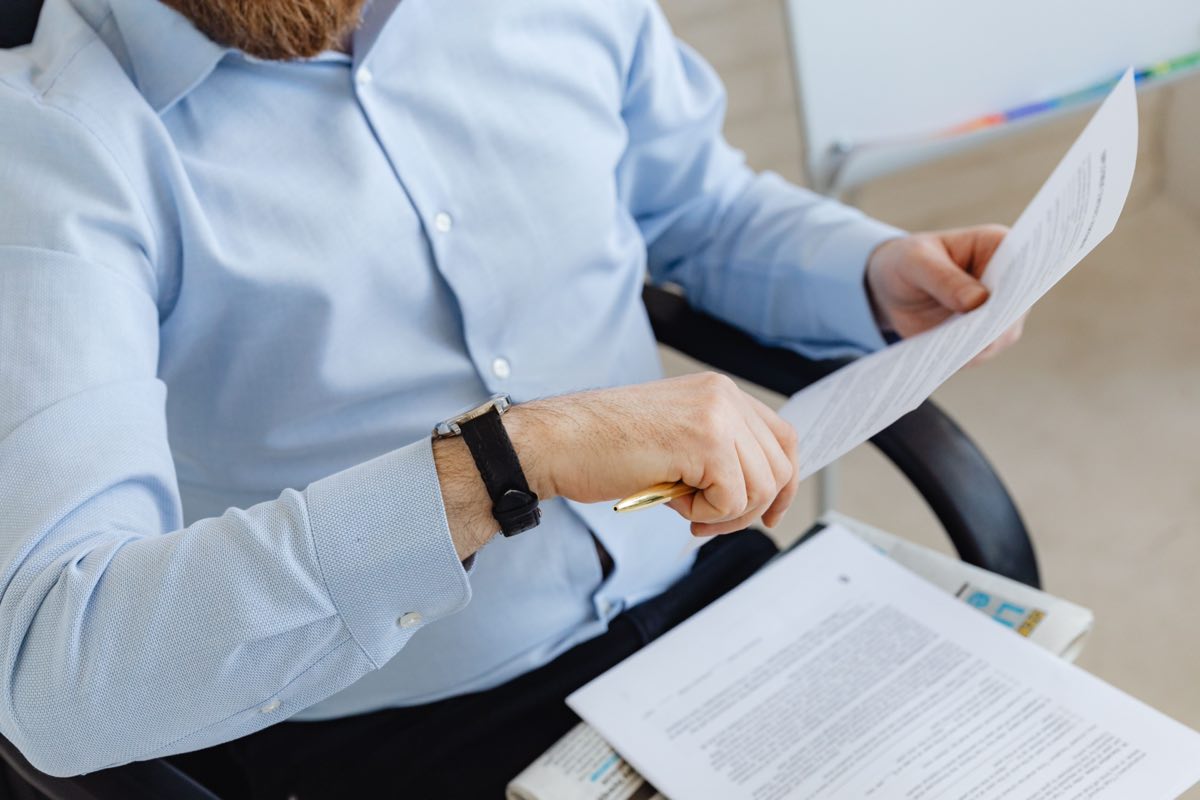 Quality professionals reviewing management-system documentation