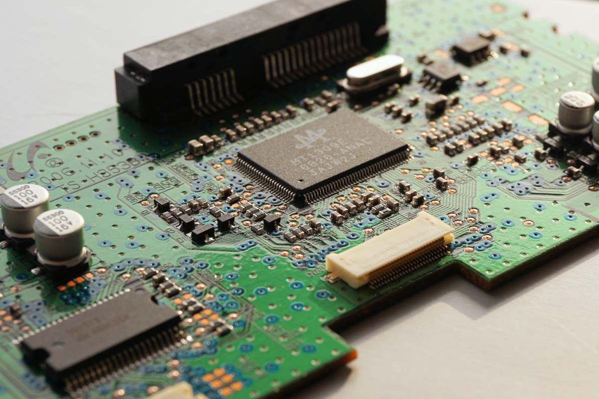 A detailed close-up of a circuit board and its microchip components