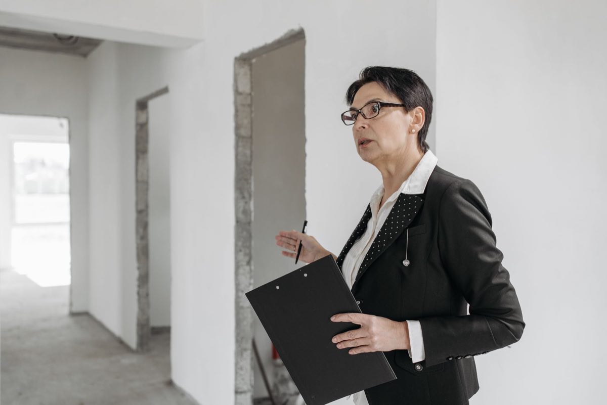 Auditor walking a facility the way a real inspector would