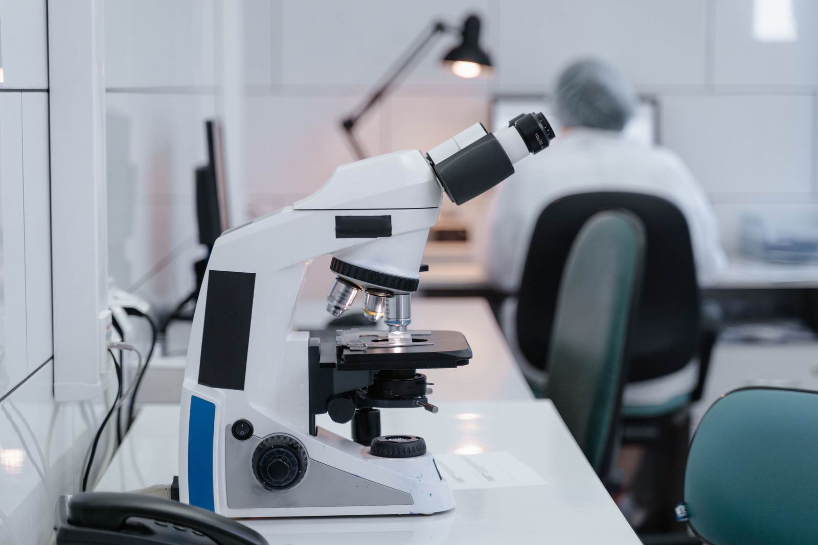 A microscope on a desk in a modern laboratory