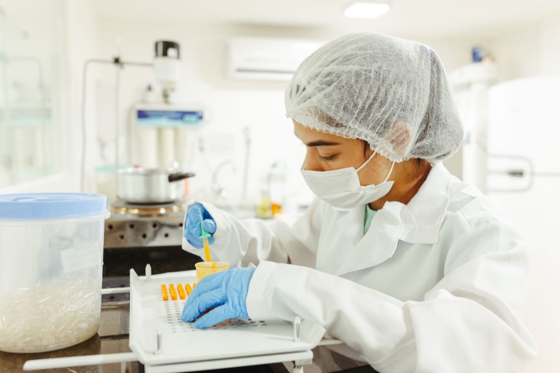 A scientist preparing samples in a laboratory