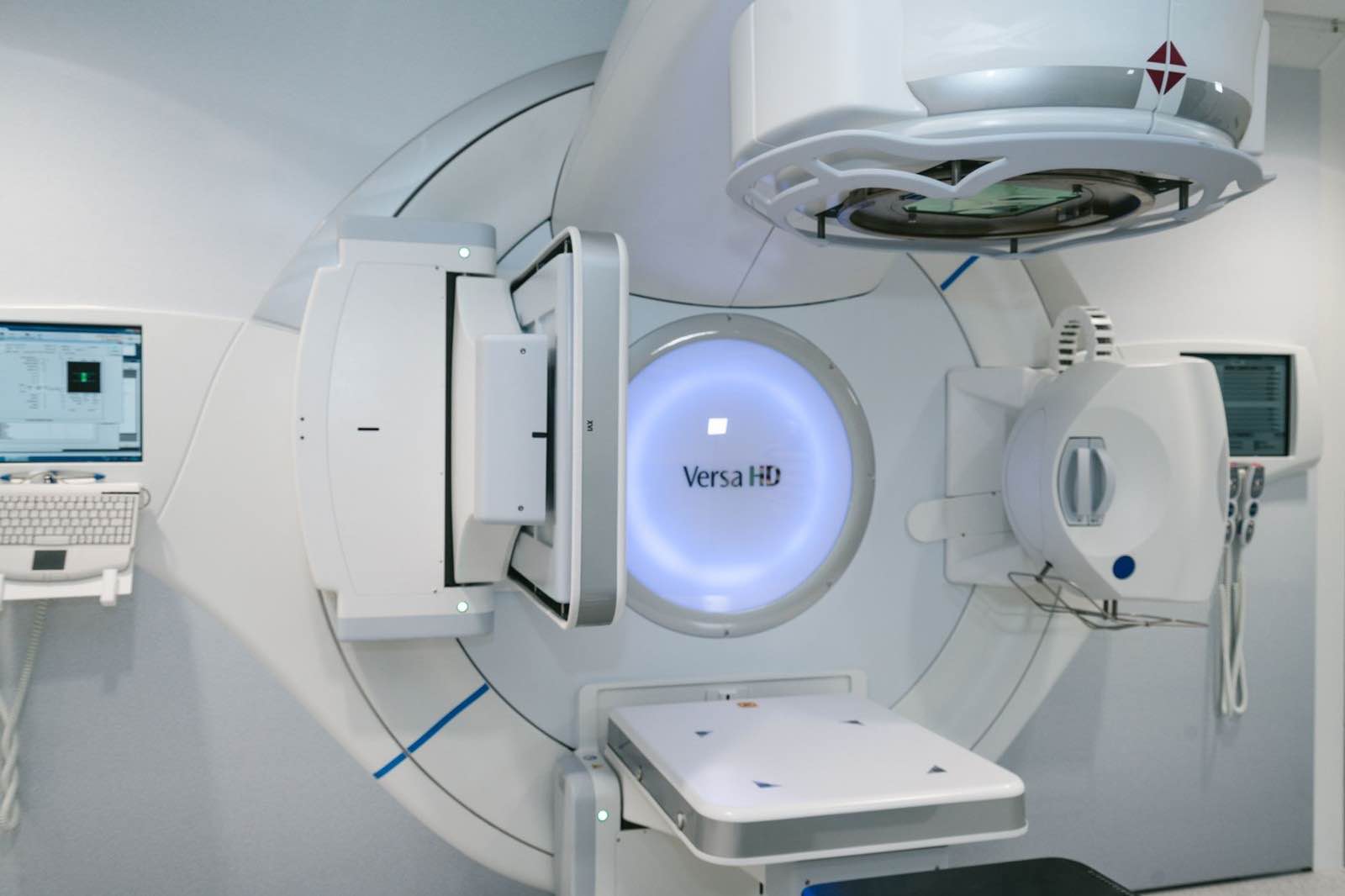 Glowing Versa HD linear accelerator in a modern radiotherapy suite